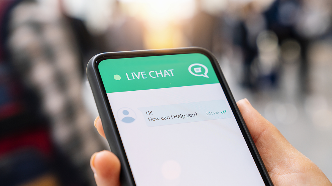 A phone with Live Chat app, showing a message from someone 
