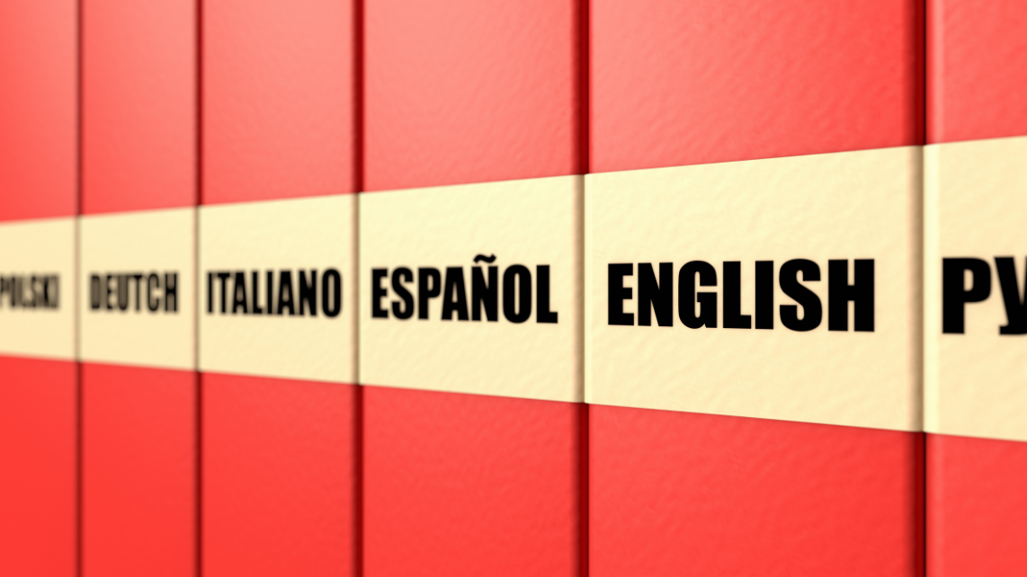 An image of red books with tags of languages for each such as Italiano, English, etc