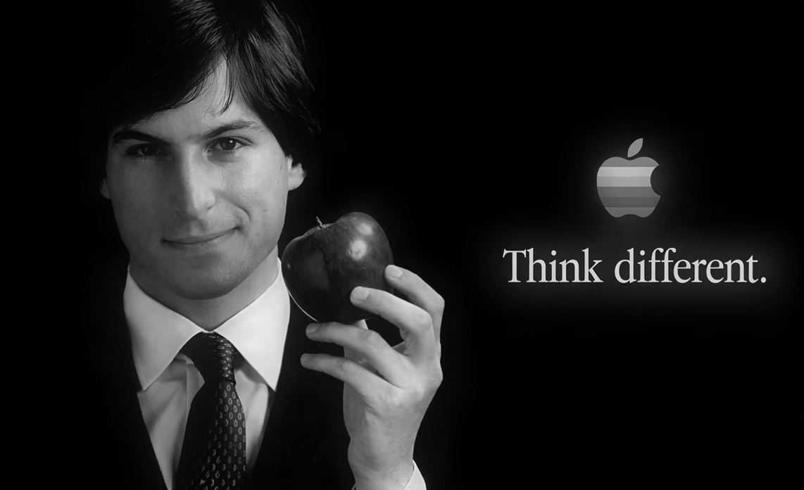 An image from the video wherein Steve Jobs is holding an apply and showing their famous tagline 