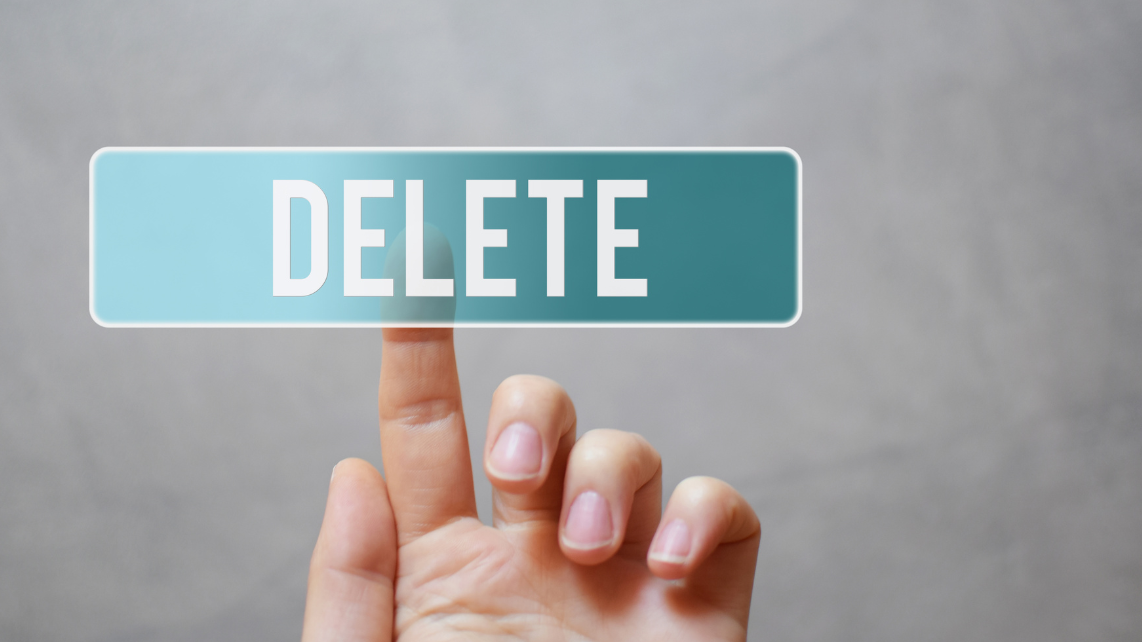 A finger pressing blue translucent Delete button