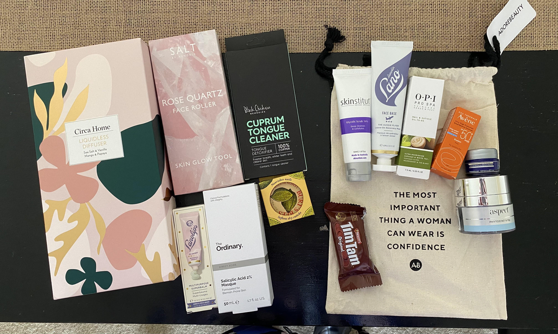 Adore Beauty products together with their free Tim Tam biscuit